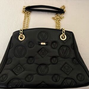 Elegant Black Designer Handbag Mario Valentino with Gold Accents, new condition